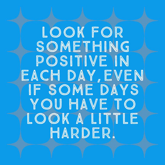 Mini wooden quote board with a Look for Something Positive quote on a vivid blue background.
