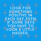 Mini wooden quote board with a Look for Something Positive quote on a vivid blue background.